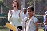 Julia Gillard attends a clinic for disadvantaged youth conducted by cricket players from Australia.