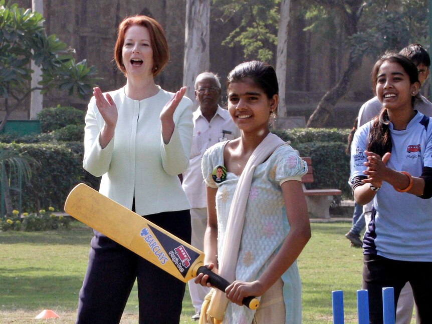 Julia Gillard attends a clinic for disadvantaged youth conducted by cricket players from Australia.