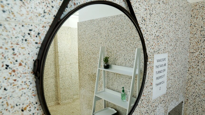 A white stand can be seen in the reflection of the new circular mirror in the girls bathroom at Penola High.