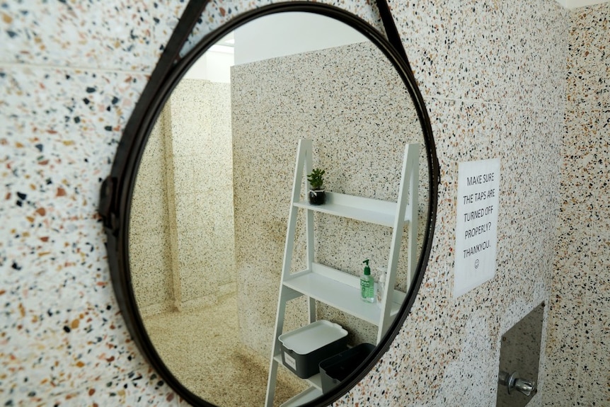 A white stand can be seen in the reflection of the new circular mirror in the girls bathroom at Penola High.