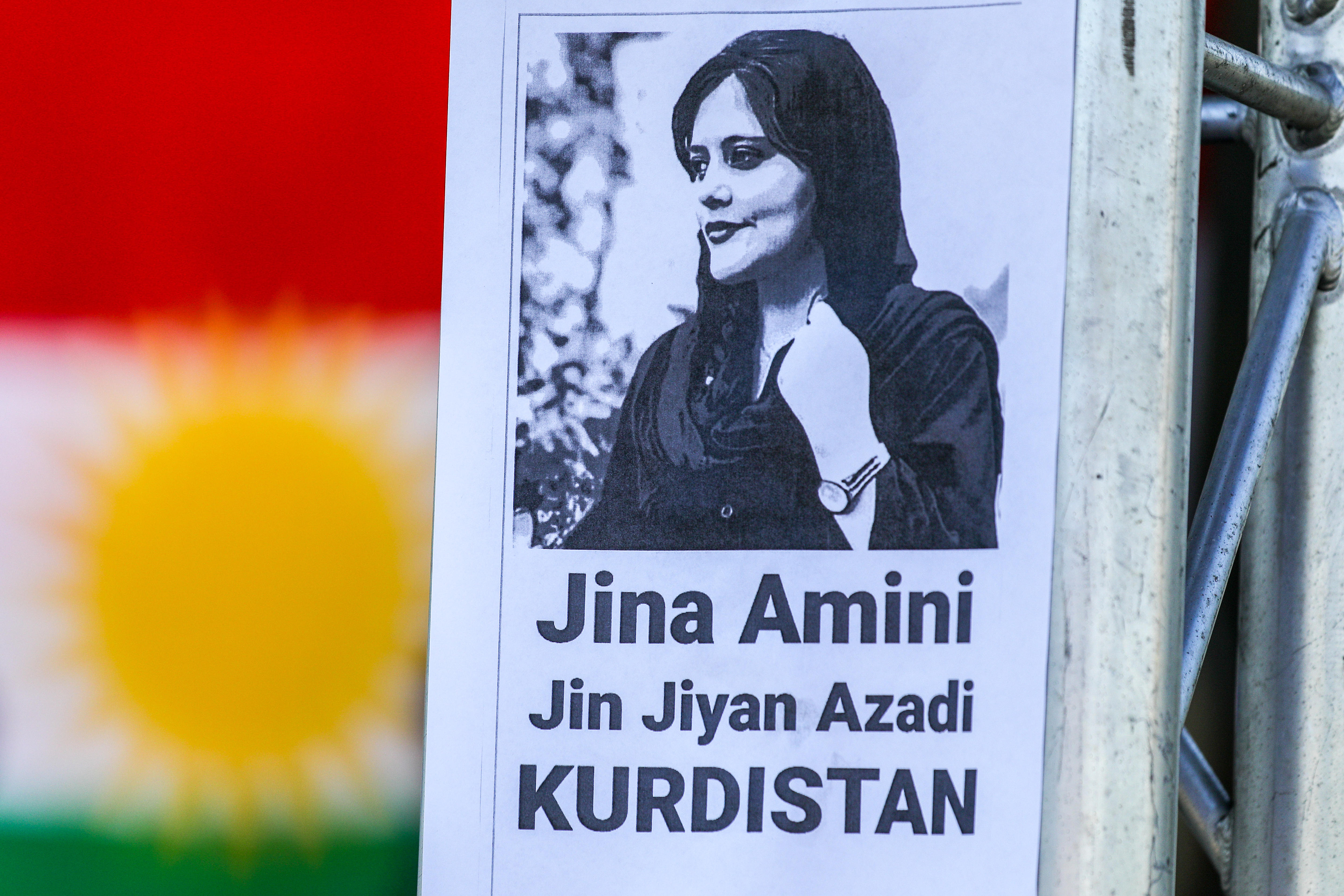 A black and white poster featuring an image of a woman.