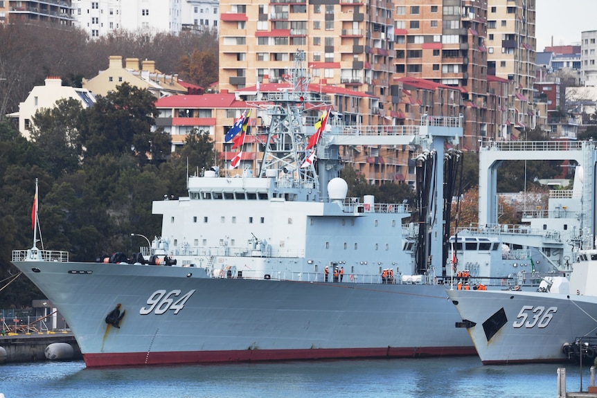 A Chinese Navel ship is seen as it docks with two others, after arriving at Garden Island Naval Base in Sydney