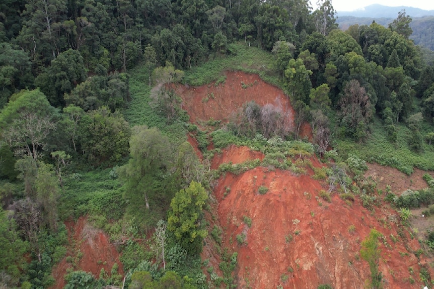 A photo taken from the air of a massive landslip on the side of a hill