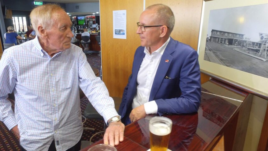 Former Labor politician George Weatherill and his son Jay have a beer together at a hotel bar.