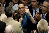 Gabrielle Giffords returns to vote and receives thunderous applause