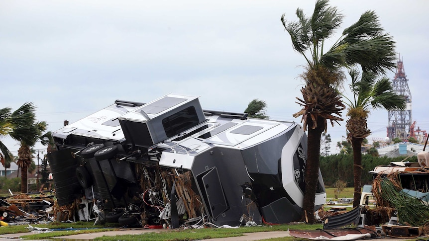 Large RV smashed and tipped over