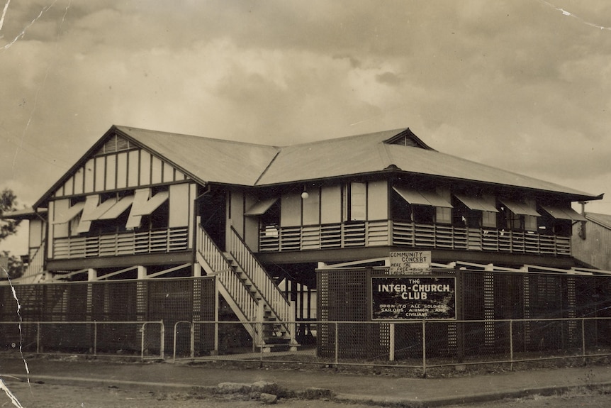 Black and white photo of an old tropical house with many louvres.