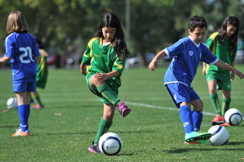Children play soccer at Gosch's Paddock in Melbourne.