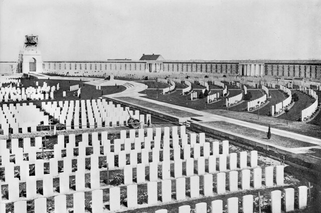 A black and white photo of the Tyne Cot Cemetery, featuring rows of headstones