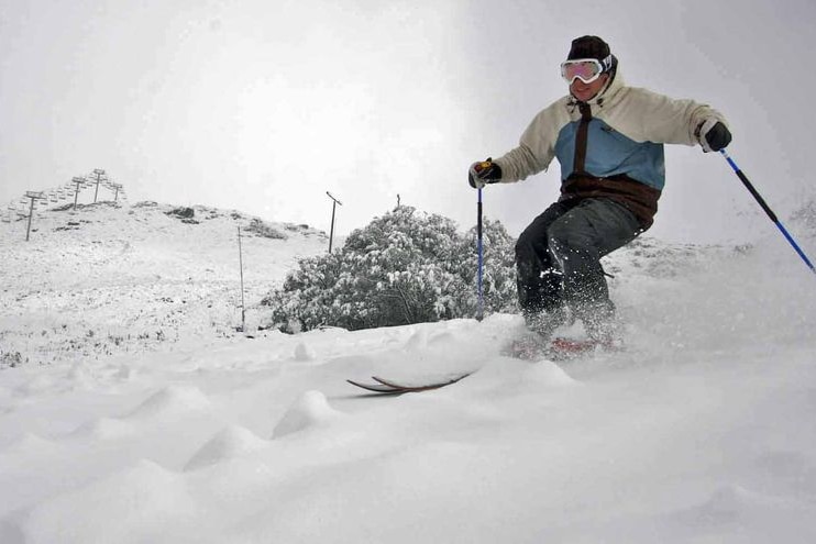 A skier on the slopes.