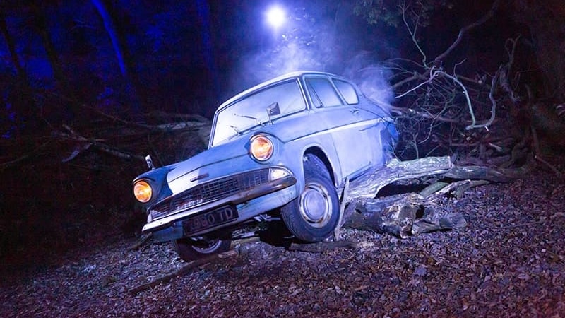 A prop car in a forest