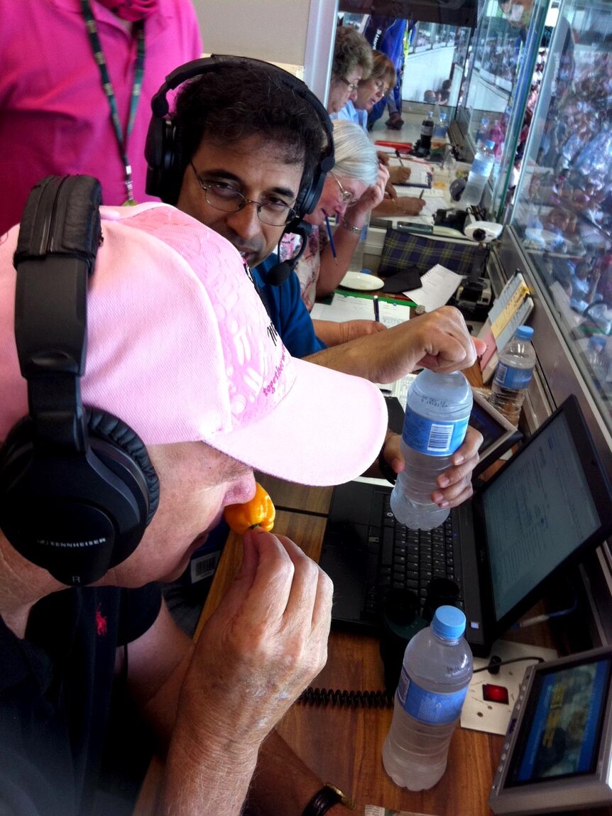 Harsha Bhogle and Kerry O'Keefe size up a Naga chilli in the SCG commentary box.
