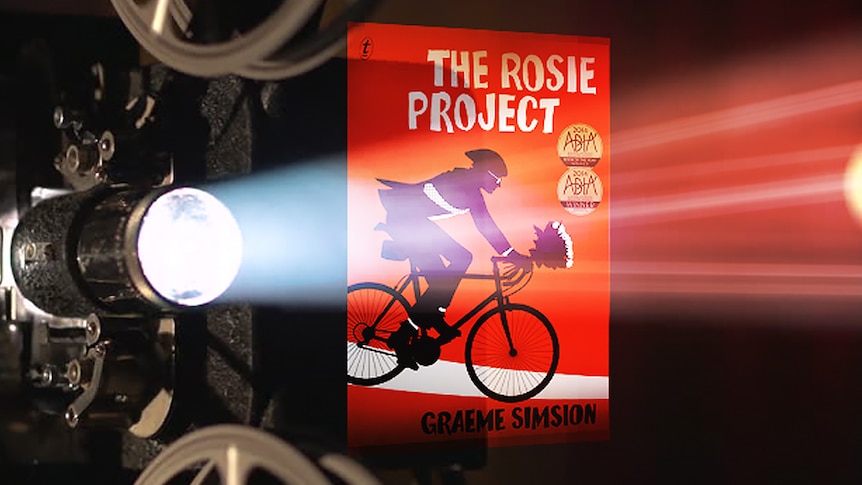 A film projector shines light through the book cover of The Rosie Project.