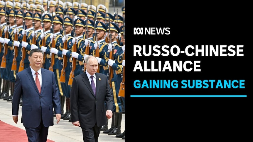 Russo-Chinese Alliance, Gaining Substance: Xi Jinping and Vladimir Putin walk down a red carpet lined with an armed guard.