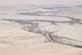 Aerial view of flood water heading south towards Lake Eyre