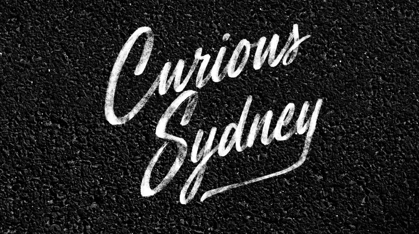 Curious Sydney written on the pavement.