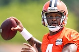 Cleveland Browns quarterback Deshaun Watson prepares to throw a football at NFL training.