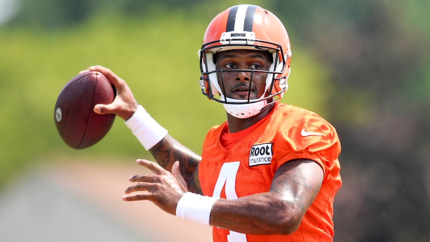 Cleveland Browns quarterback Deshaun Watson prepares to throw a football at NFL training.