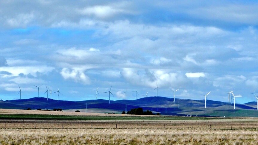 wind farm turbines on hills.
