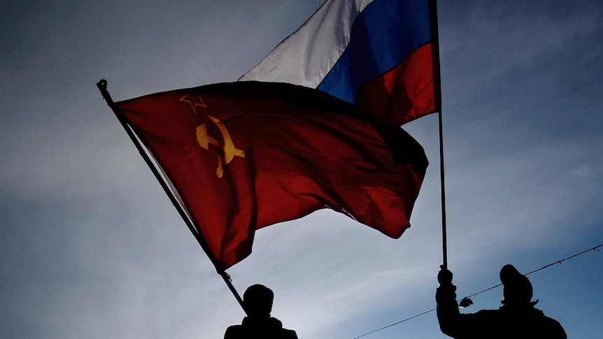 Men wave Russian flag in Crimea