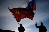 Men wave Russian flag in Crimea