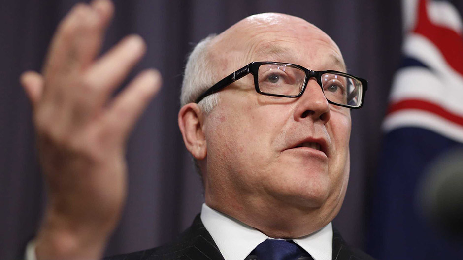 George Brandis speaks to the media during a press conference at Parliament House