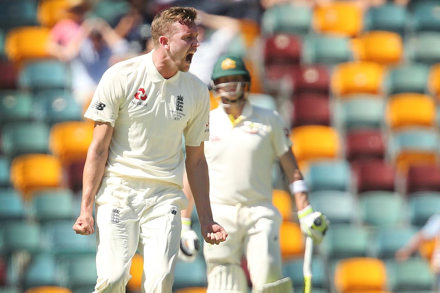 England bowler Jake Ball reacts after claiming the wicket of Australian batsman David Warner