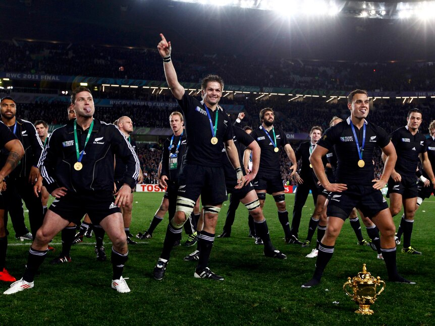 Time to party ... All Blacks captain Richie McCaw leads pitch-side celebrations after New Zealand finally ended its World Cup drought.