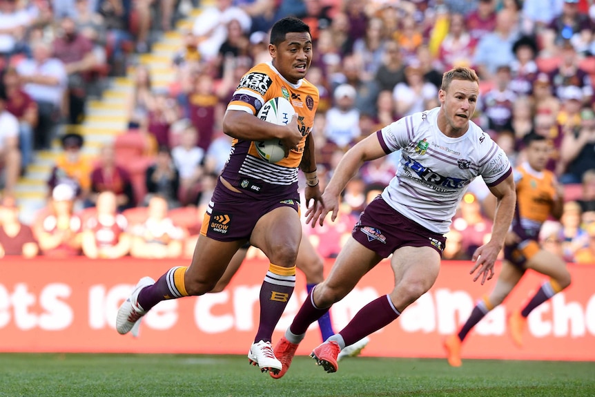 Anthony Milford runs past Daly Cherry-Evans in the Broncos versus Sea Eagles NRL match.