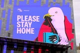 A sign saying "please stay home".