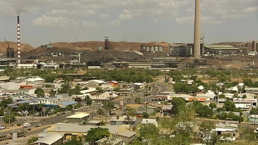 Main streets of city of Mount Isa in north-west Qld, with mine and smokestack in background