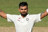 Virat Kohli of India celebrates after reaching 100 runs during day three of the First Test match between Australia and India at Adelaide Oval