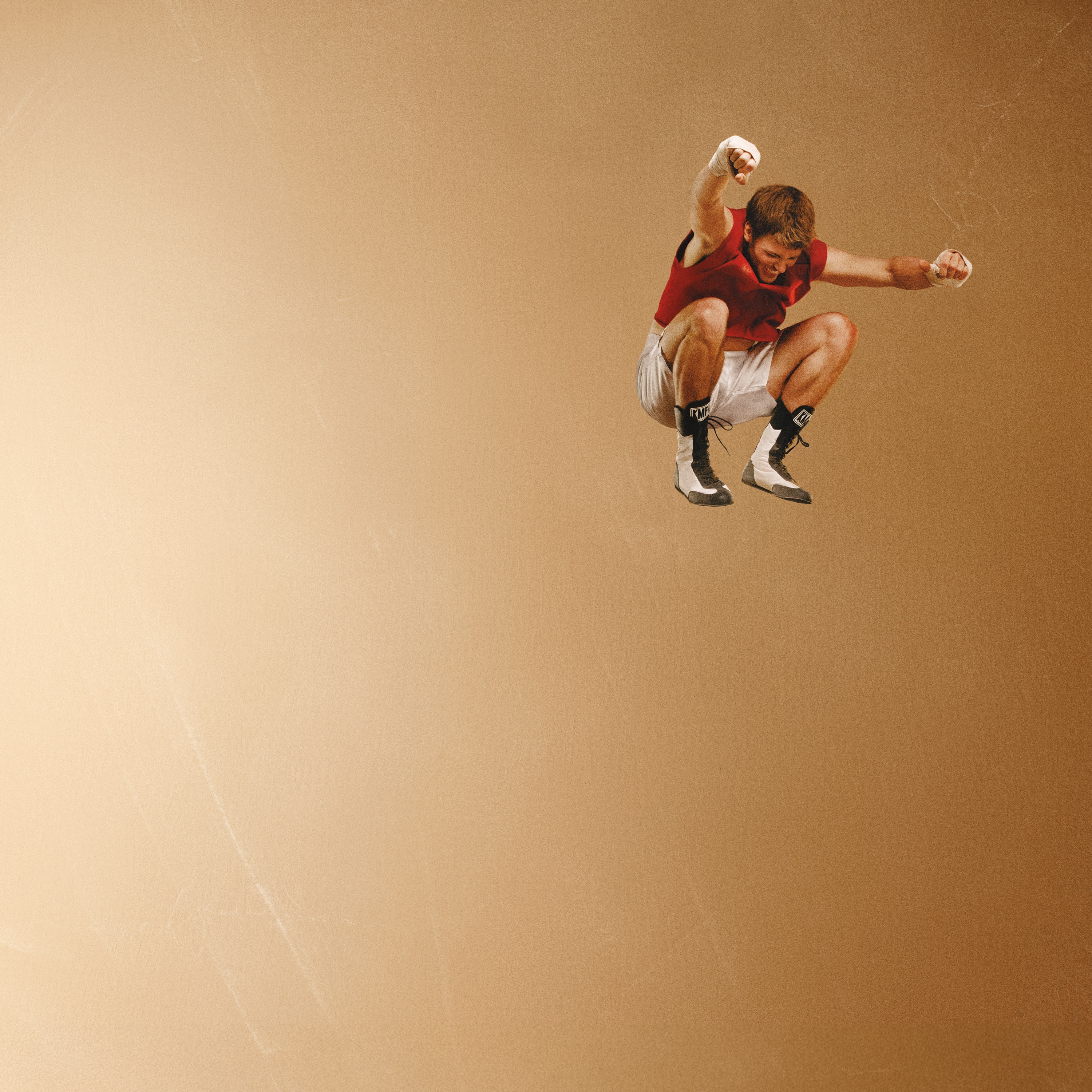 Ruel mid-air jump on beige background