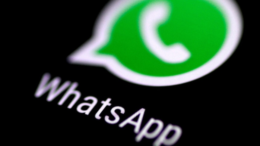 The WhatsApp messaging application is seen on a phone screen.