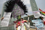 A transsexual holds a placard during an International Day Against Homophobia demonstration in Jakarta.