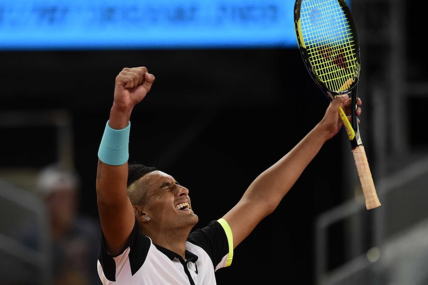 Nick Kyrgios celebrates his win over Roger Federer