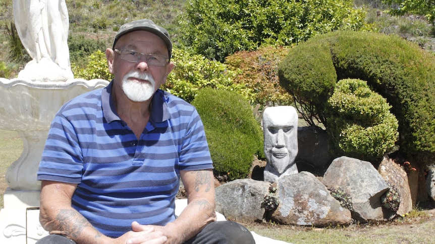 George Dolbey sitting in his garden