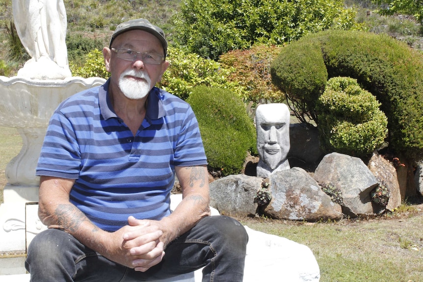 George Dolbey sitting in his garden