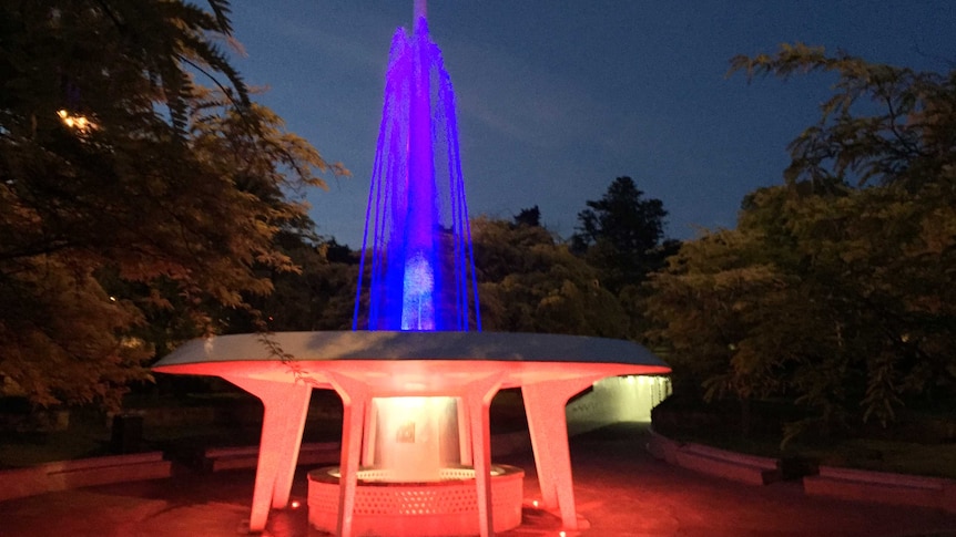 Hobart fountain lit in the Tricolour