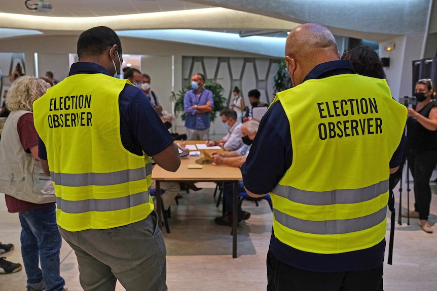 Election observers at a vote count.