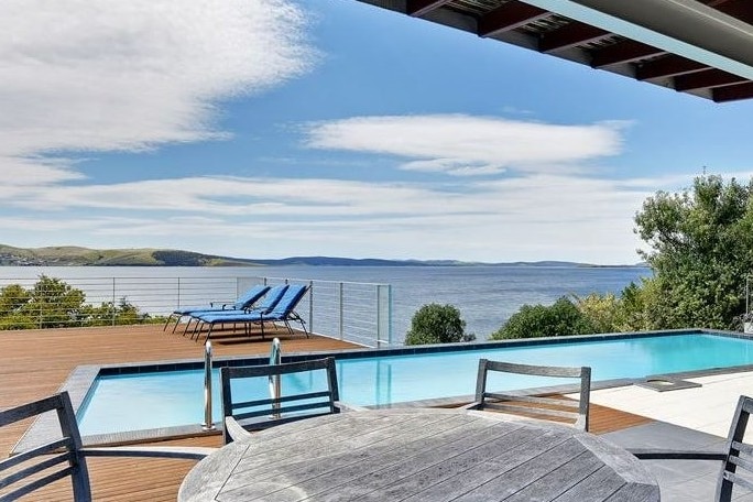 A deck and water views at Tasmanian property.