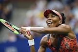 Venus Williams makes a backhand return against Petra Kvitova.