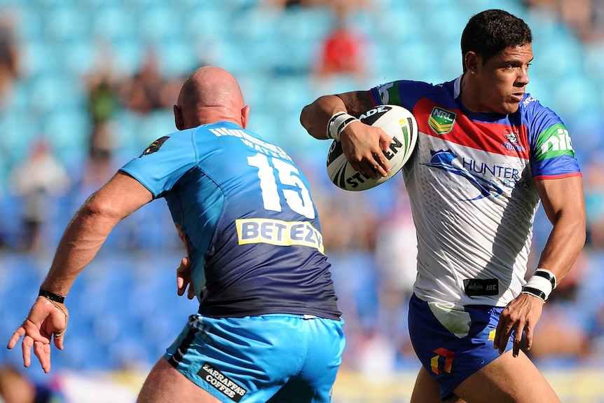 Convincing win ... Newcastle's Dane Gagai ghosts past the Titans defence.