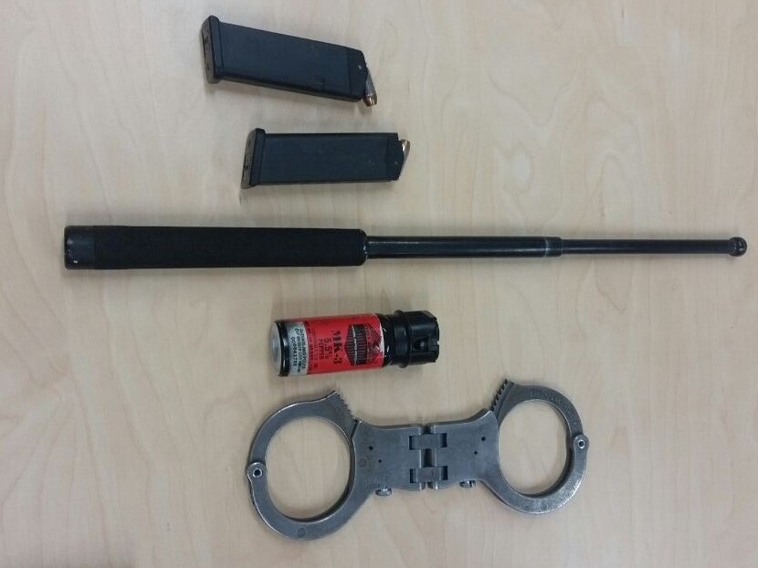 Capsicum spray, handcuffs, a baton and two Glock magazines with ammunition