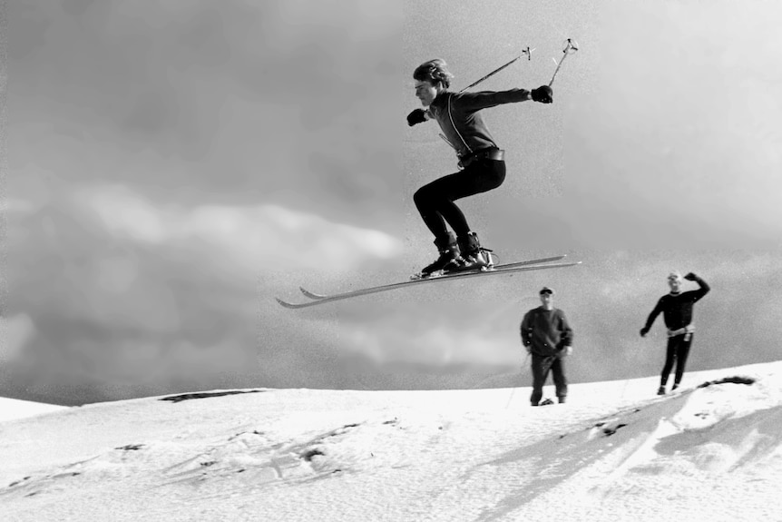 Black and white picture of skiier completing aerial jump