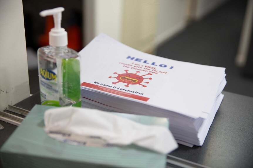 A hand sanitiser, box of tissues and coronavirus information pack