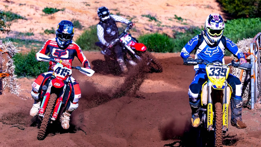 man on motorcycle wearing red racing on dirt track