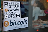 Shop sign welcomes bitcoin purchases