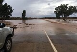 Four-wheel drive stopped in outback due to flooding.