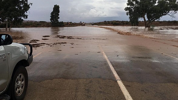Four-wheel drive stopped in outback due to flooding.